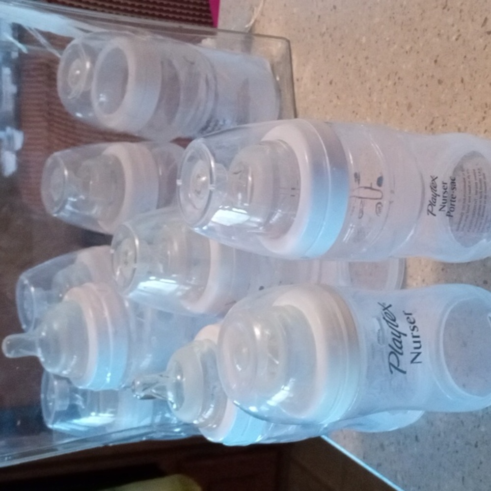 Nine Playtex nurser drop in baby bottles